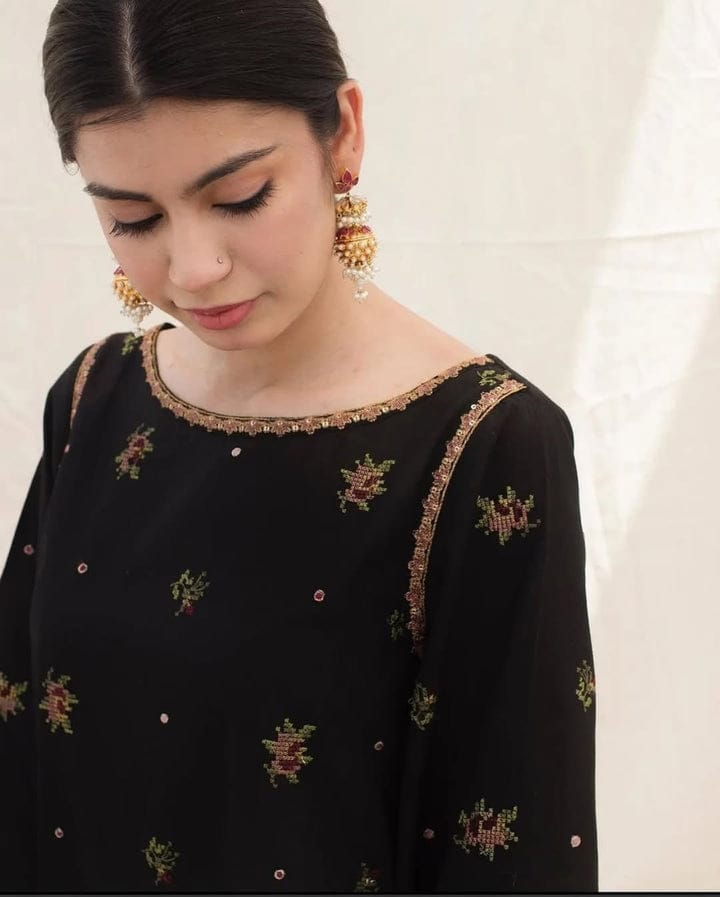 Black Stone embroidered organza suit with detailed tilla work.