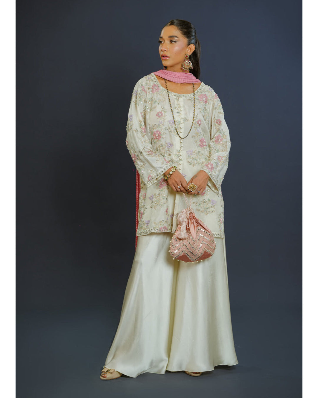 Gulnaar organza outfit with handmade embellishments and chunri dupatta.