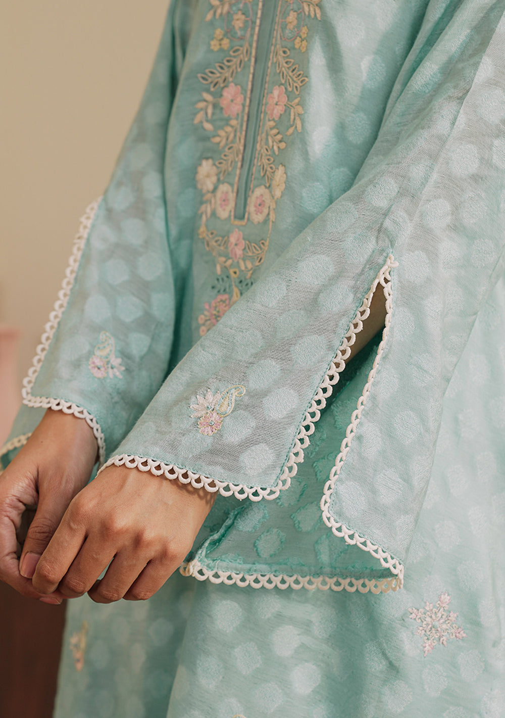 Zaal mint green embroidered lawn outfit with organza dupatta.