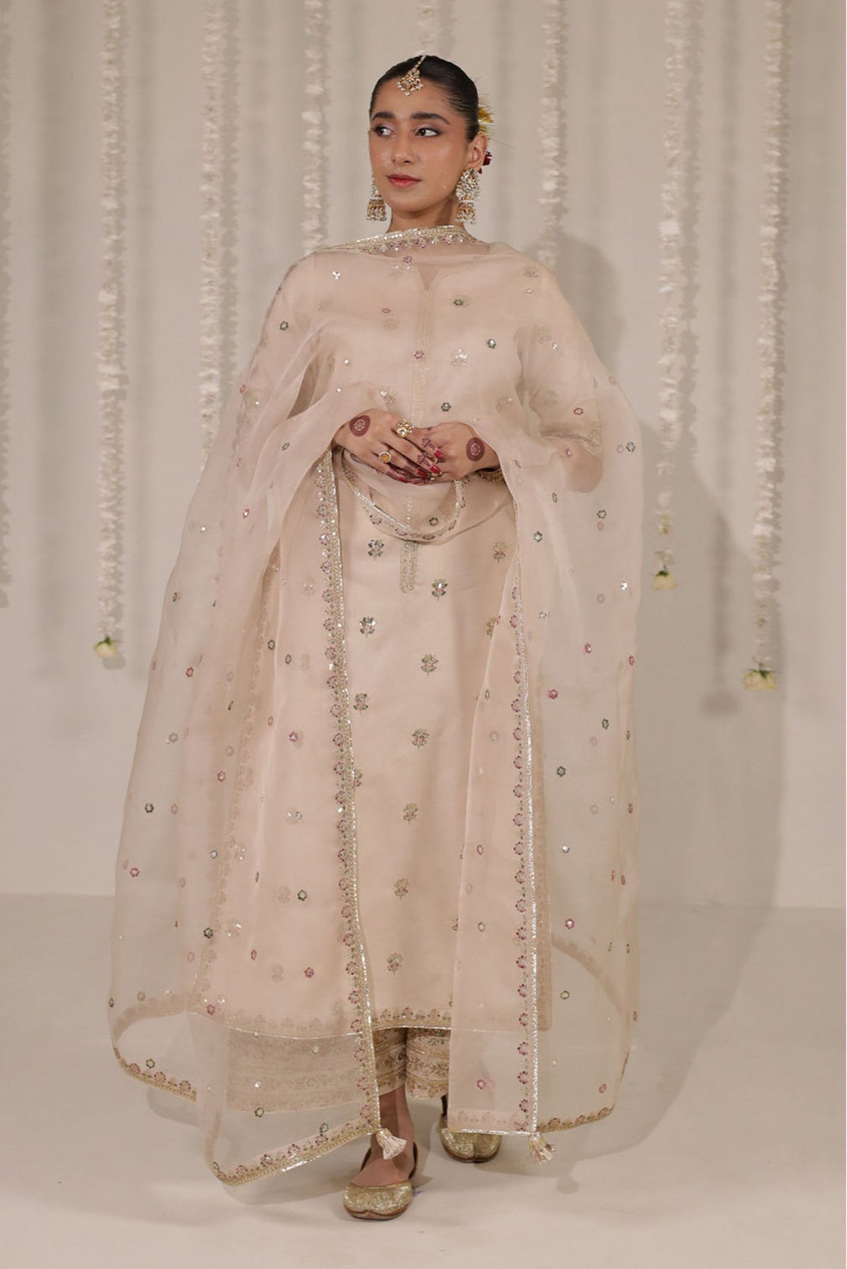Zarnoor elegant champagne suit with glistening mirror-style embroidery.